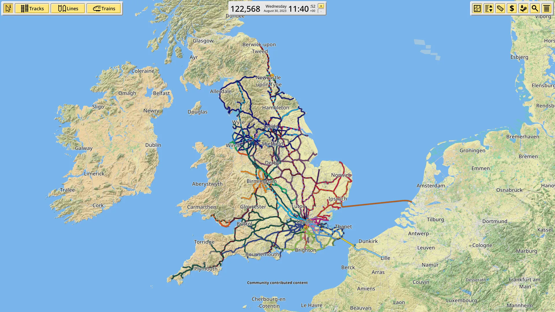 A NIMBY Rails network of coloured lines drawn across a real map of Great Britain and Ireland