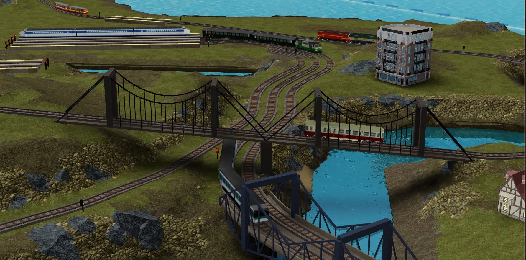 A busy junction of suspension and beam bridges threads trains across a river delta.